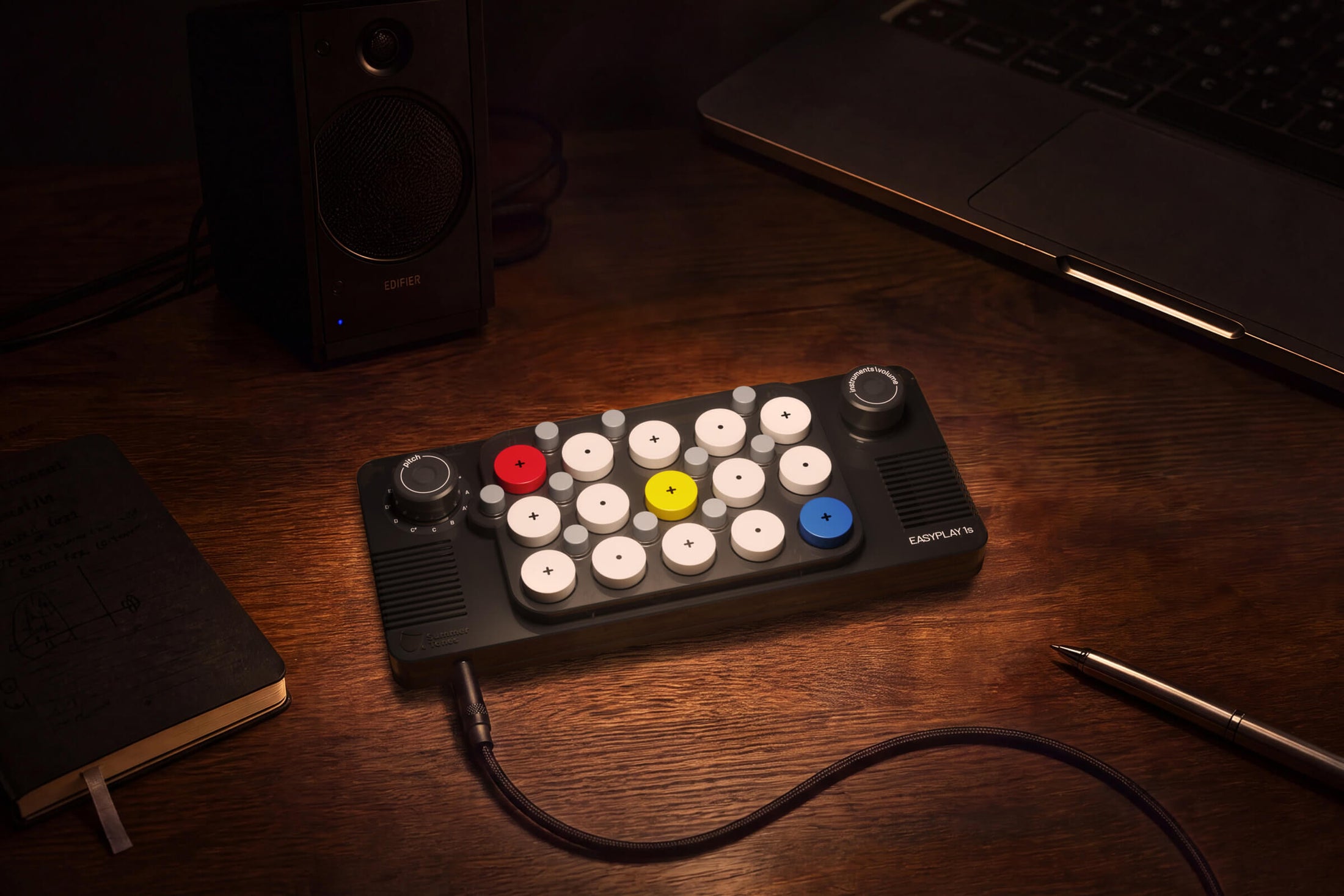EASYPLAY 1S connected beside a laptop in a music workspace